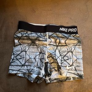 Black, grey, and white Nike Pro Spandex Shorts
